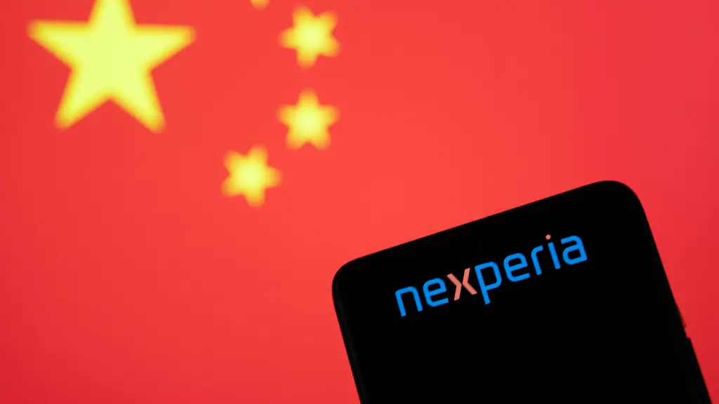 Photo-illustration-of-Nexperia-logo-displayed-on-a-smartphone-screen-with-the-national-flag-of-the-People-s-Republic-of-China-also-known-as-the-Five-star-Red-Flag-in-the-background-Nexperia-B-V-is-a-semiconductor-manufacturer-a-tech-company-headquartered-in-Nijmegen-the-Netherlands-subsidiary-of-Wingtech-Technology-a-Shanghai-listed-company-partially-owned-by-the-Chinese-government-As-of-October-2025-the-Dutch-government-took-control-of-governance-of-the-firm-citing-security-concerns