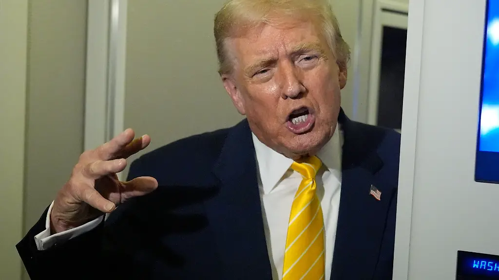 President-Donald-Trump-speaks-to-reporters-on-Air-Force-One-on-his-way-to-his-Mar-a-Lago-estate-in-Palm-Beach-Fla-Friday-Nov-14-2025