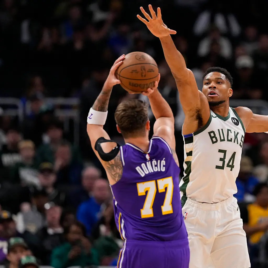 Nov-15-2025-Milwaukee-Wisconsin-USA-Milwaukee-Bucks-forward-Giannis-Antetokounmpo-34-defends-Los-Angeles-Lakers-guard-Luka-Doncic-77-during-the-first-quarter-at-Fiserv-Forum