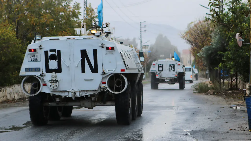 UN-peacekeepers-UNIFIL-vehicles-ride-along-a-street-amid-ongoing-hostilities-between-Hezbollah-and-Israeli-forces-in-Marjayoun-near-the-border-with-Israel-southern-Lebanon-November-19-2024