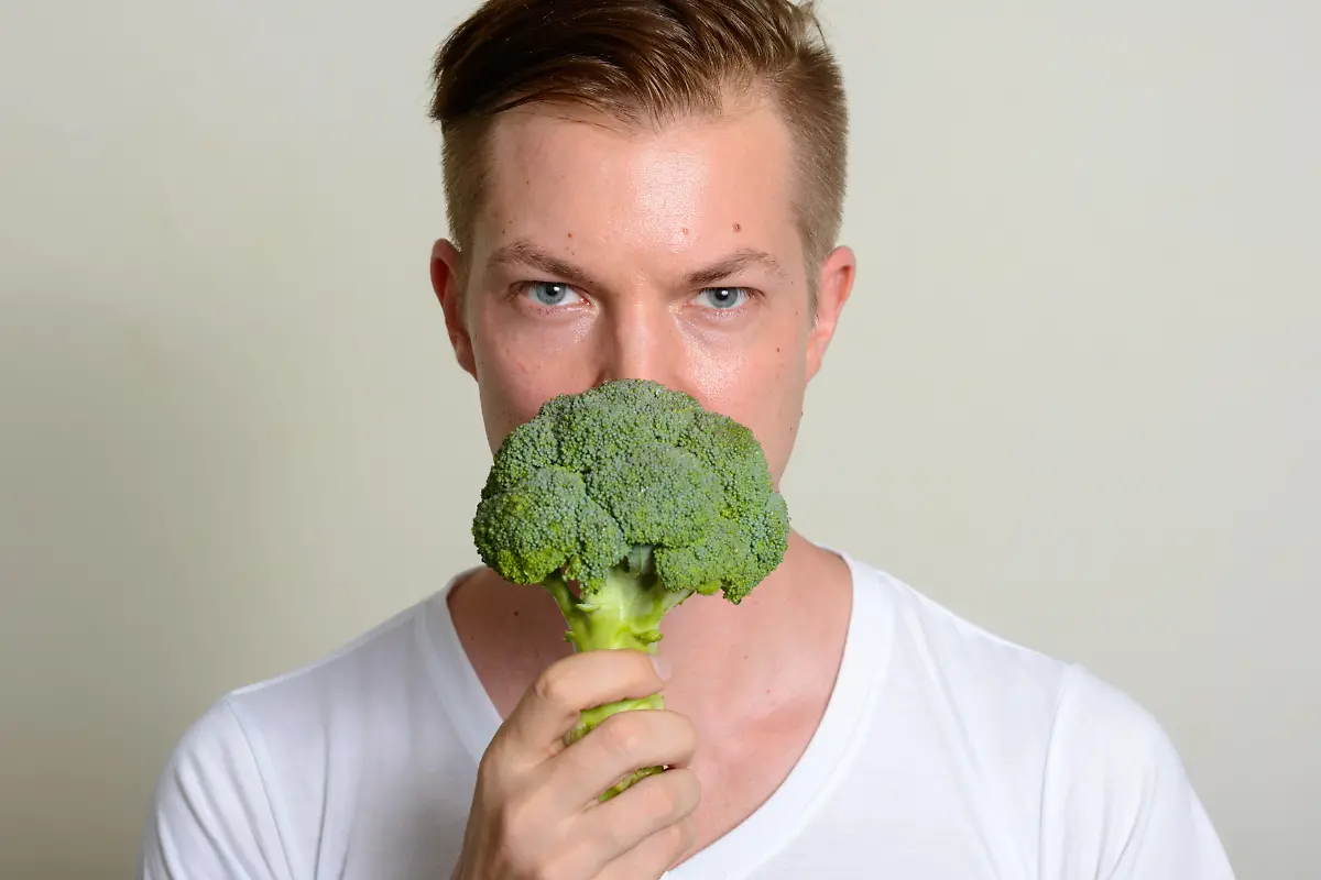 Studio-shot-of-young-handsome-Scandinavian-man-against-white-background