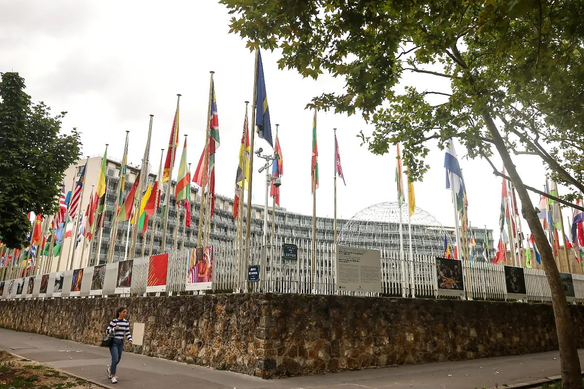 A-woman-walks-by-the-UNESCO-headquarters-Tuesday-July-22-2025-in-Paris