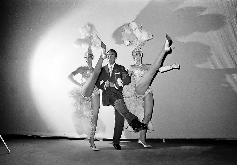 Actor-comedian-Red-Skelton-rehearses-a-number-for-The-Red-Skelton-Show-with-dancers-Alice-left-and-Ellen-Kessler-who-are-identical-twins-in-Hollywood-Ca-in-Jan-1963-Skelton-invited-the-German-dancers-to-appear-on-his-show-after-seeing-them-in-their-act-at-the-Lido-in-Paris-France