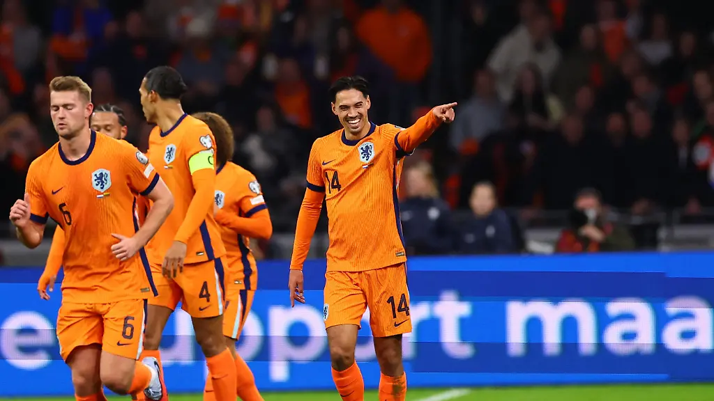 Soccer-Football-World-Cup-UEFA-Qualifiers-Group-G-Netherlands-v-Lithuania-Johan-Cruijff-Arena-Amsterdam-Netherlands-November-17-2025-Netherlands-Tijjani-Reijnders-celebrates-scoring-their-first-goal-with-Virgil-van-Dijk-Matthijs-de-Ligt-and-teammates-REUTERS-Piroschka-Van-De-Wouw