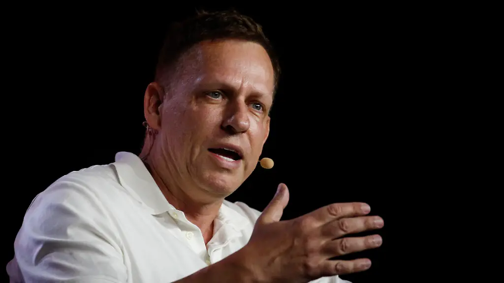 MIAMI-FLORIDA-APRIL-7-Peter-Thiel-co-founder-of-PayPal-Palantir-Technologies-and-Founders-Fund-gestures-as-he-speaks-during-the-Bitcoin-2022-Conference-at-Miami-Beach-Convention-Center-on-April-7-2022-in-Miami-Florida-The-worlds-largest-bitcoin-conference-runs-from-April-6-9-expecting-over-30-000-people-in-attendance-and-over-7-million-live-stream-viewers-worldwide