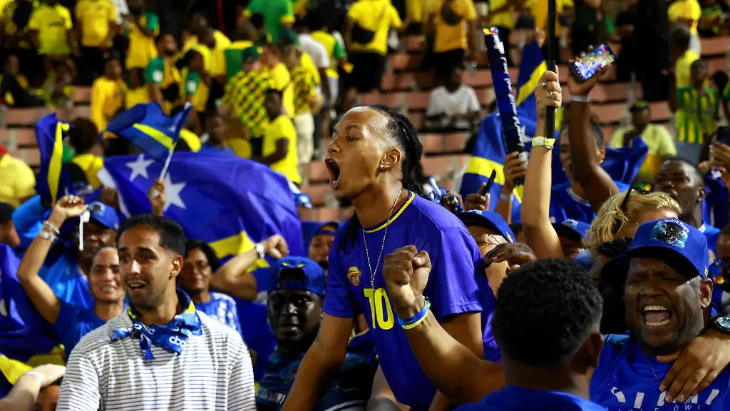 Soccer-Football-FIFA-World-Cup-CONCACAF-Qualifiers-Group-B-Jamaica-v-Curacao-National-Stadium-Independence-Park-Kingston-Jamaica-November-18-2025-Curacao-fans-celebrate-after-they-qualify-for-the-World-Cup-REUTERS-Gilbert-Bellamy