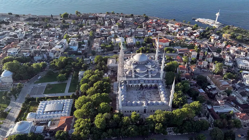 ISTANBUL-TURKIYE-JUNE-16-An-aerial-view-shows-the-Sultan-Ahmed-Mosque-The-Blue-Mosque-as-Muslims-gather-to-offer-Eid-al-Adha-prayers-in-Istanbul-Turkiye-on-June-16-2024