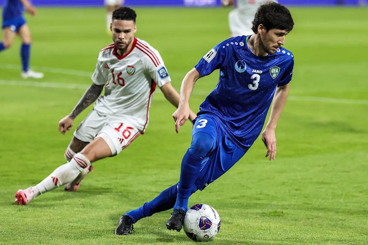 UAE-s-defender-16-Marcus-Meloni-vies-for-the-ball-against-Uzbekistan-s-defender-3-Khojiakbar-Alijonov-during-the-2026-FIFA-World-Cup-Asian-Qualifier-football-match-between-the-United-Arab-Emirates-and-Uzbekistan-at-Al-Nahyan-Stadium-in-Abu-Dhabi-on-June-5-2025