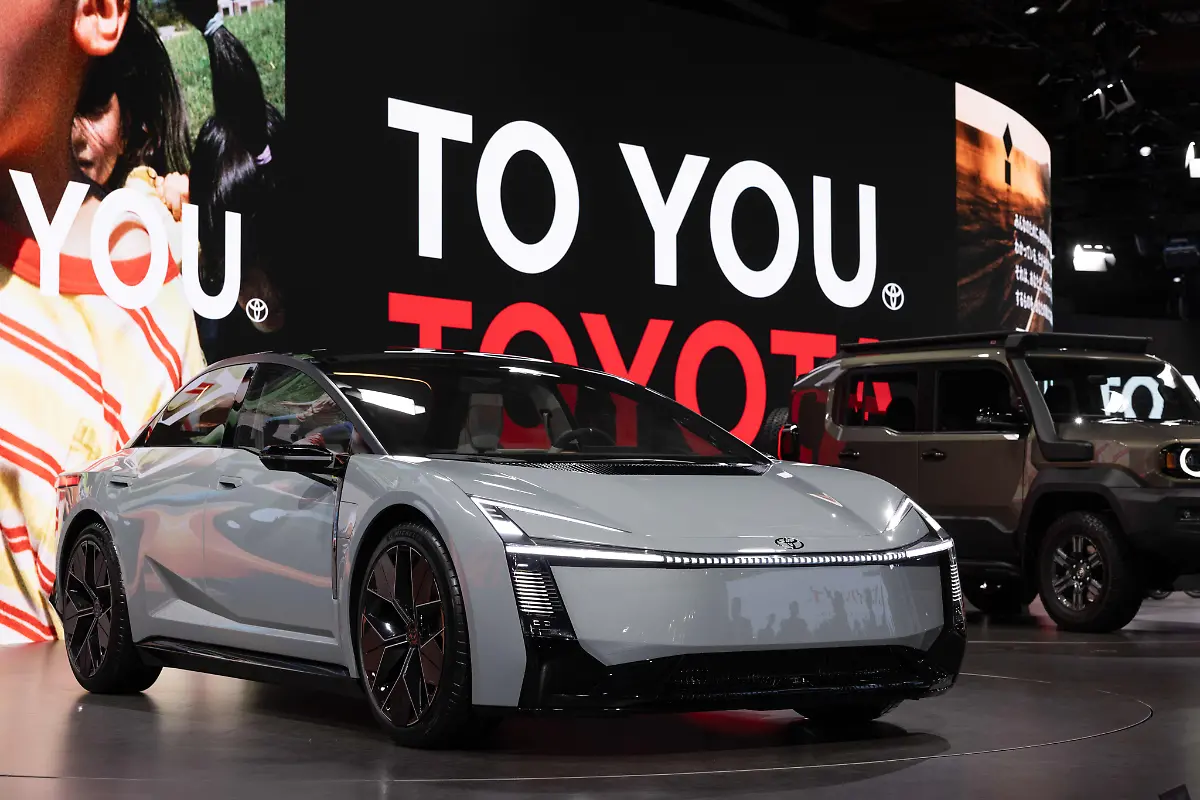 Toyota-Corolla-Concept-on-display-at-Japan-Mobility-Show-2025-Tokyo-s-Big-Sight-pulses-with-the-roar-of-innovation-as-the-Japan-Mobility-Show-2025rebranded-heir-to-the-storied-Tokyo-Motor-Showunfolds-from-October-30-to-November-9-drawing-global-eyes-to-Japan-s-evolving-automotive-ethos-Amid-whispers-of-an-EV-slowdown-exhibitors-pivot-boldly-futuristic-compact-concepts-expanded-luxury-lines-and-kei-sized-electric-runabouts-nod-to-market-specific-electrification-Manga-inspired-booths-spotlight-refreshed-minivans-and-autonomy-ready-compacts-blending-whimsy-with-wired-tech-Yet-the-narrative-diverges-from-2023-s-full-throttle-EV-fervor-Hybrids-and-performance-icons-reassert-Japan-s-I-told-you-so-on-balanced-powertrains-tempered-by-software-and-sustainability-hurdles-Interactive-gems-abound-mini-mobility-careers-for-tots-kei-truck-bazaars-hauling-regional-wares-and-a-future-tour-immersing-visitors-in-2035-s-seamless-lifestyles-This-biennial-bazaar-isn-t-just-vehicles-it-s-a-manifesto-for-Mobility-for-All-challenging-the-world-to-redefine-roads-less-traveled