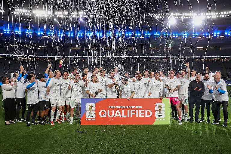 New-Zealand-s-team-celebrate-after-their-victory-during-the-FIFA-World-Cup-2026-Oceania-qualifiers-group-final-football-match-between-New-Zealand-and-New-Caledonia-at-Eden-Park-Stadium-in-Auckland-on-March-24-2025