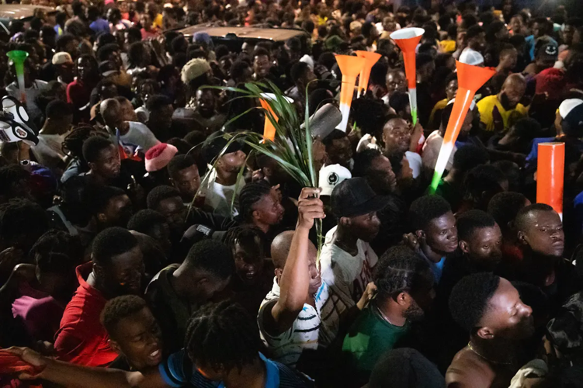 Fans-cheer-in-the-streets-of-Port-au-Prince-on-November-18-2025-as-Haiti-celebrates-its-victory-over-Nicaragua-and-qualification-for-the-2026-FIFA-World-Cup-Haiti-who-last-appeared-in-the-World-Cup-in-1974-completed-an-improbable-qualification-campaign-with-a-2-0-win-over-Nicaragua-Ironically-Haiti-secured-their-decisive-qualification-victory-in-Curacao-where-the-team-have-been-forced-to-play-their-home-qualifiers-due-to-unrest-in-their-homeland
