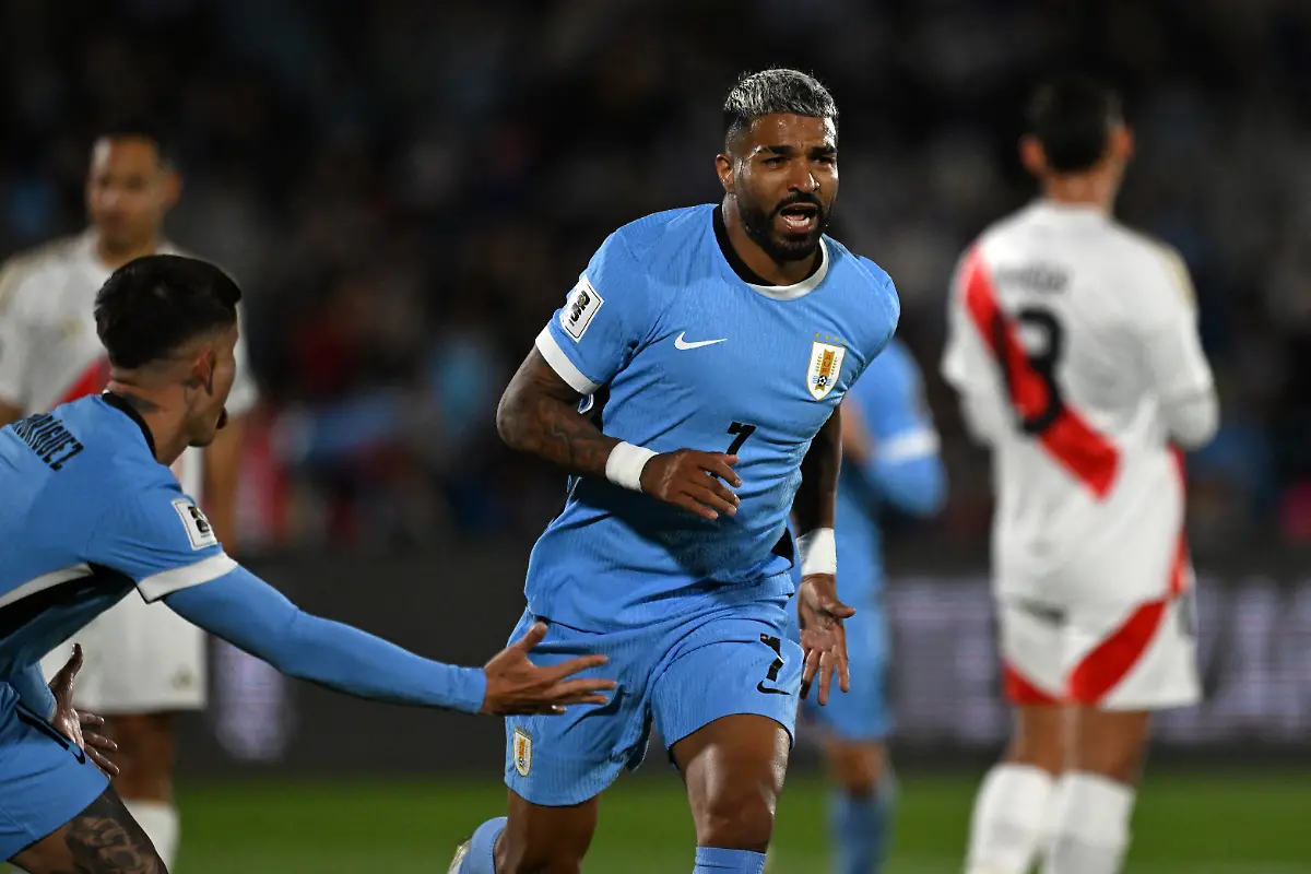 Uruguay-s-forward-07-Rodrigo-Aguirre-celebrates-with-Uruguay-s-defender-18-Brian-Rodriguez-after-scoring-his-team-s-first-goal-during-the-2026-FIFA-World-Cup-South-American-qualifiers-football-match-between-Uruguay-and-Peru-at-the-Centenario-stadium-in-Montevideo-on-September-4-2025