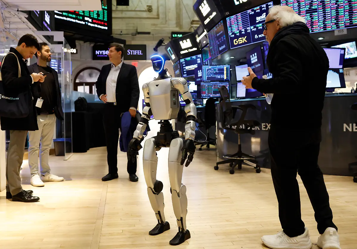 A-Unitree-Robotics-G1-Humanoid-Robot-walks-on-the-floor-of-the-New-York-Stock-Exchange-on-Wall-Street-on-Monday-November-10-2025-in-New-York-City