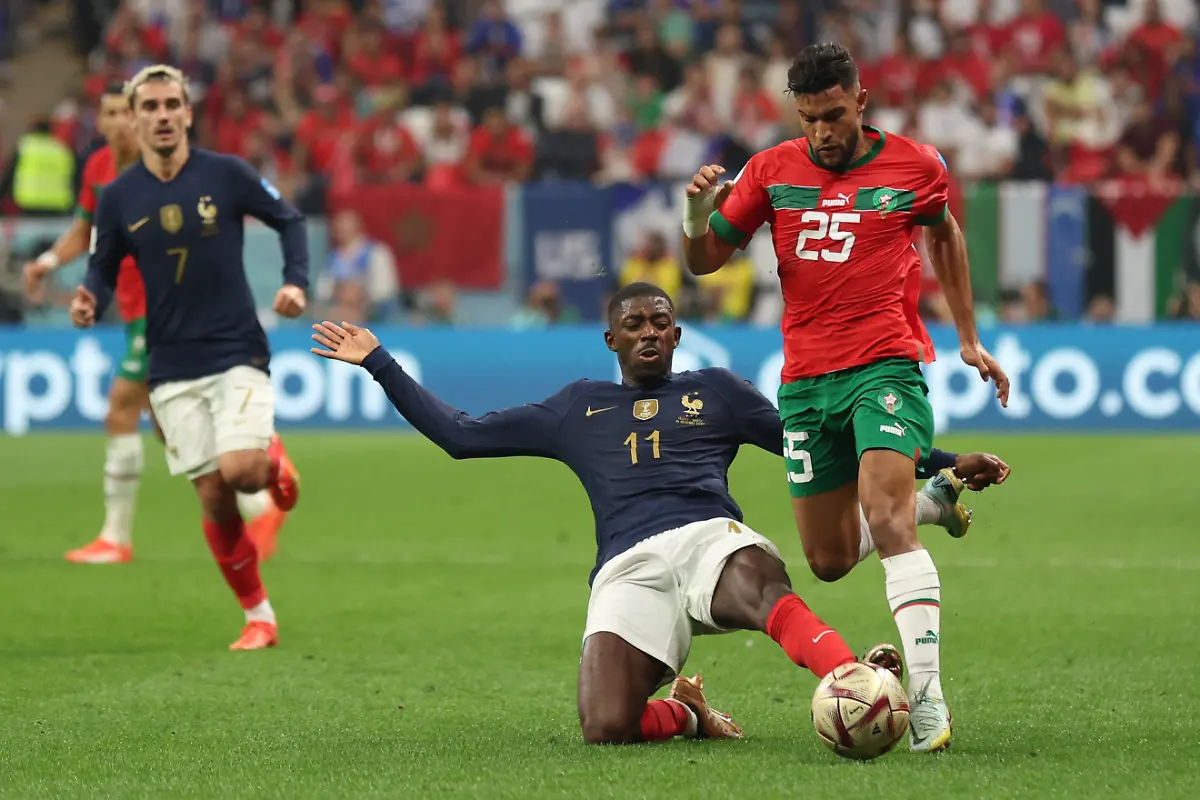 Morocco-s-defender-25-Yahya-Attiyallah-is-challenged-by-France-s-forward-11-Ousmane-Dembele-during-the-Qatar-2022-World-Cup-semi-final-football-match-between-France-and-Morocco-at-the-Al-Bayt-Stadium-in-Al-Khor-north-of-Doha-on-December-14-2022