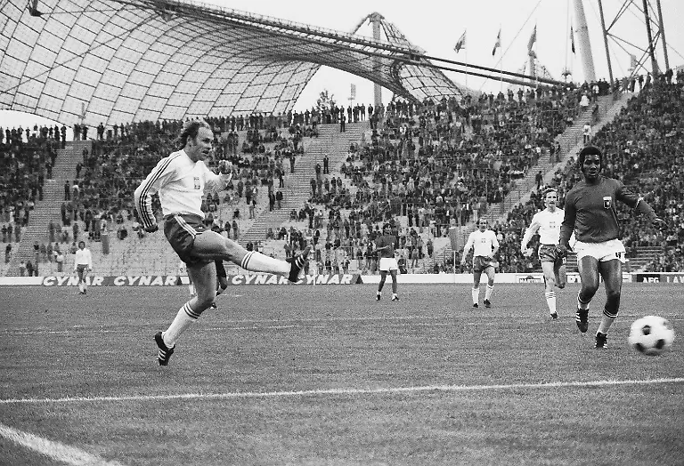 FILE-In-this-June-19-1974-file-photo-Poland-s-Grzegorz-Lato-hits-the-ball-past-Haitian-defender-Wilner-Nazaire-to-score-his-team-s-first-goal-in-the-World-Cup-Finals-match-in-Munich-former-West-Germany-Sixty-years-later-Just-Fontaine-s-scoring-record-of-13-goals-in-a-single-World-Cup-still-looks-unbeatable-but-at-least-England-striker-Harry-Kane-has-a-chance-to-move-up-in-the-list-of-pretenders-A-goal-against-Sweden-in-the-quarterfinals-on-Saturday-July-7-2018-would-move-him-level-with-Grzegorz-Lato-the-prolific-Poland-striker-bagged-seven-in-as-many-games-in-1974
