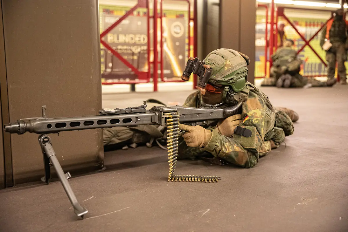 German-soldiers-from-the-Wachbataillon-took-part-in-the-nighttime-Bollwerk-Baerlin-III-exercise-at-Jungfernheide-U-Bahn-station-in-Berlin-on-Wednesday-November-19-2025-The-large-scale-drill-trained-troops-to-fight-in-confined-underground-spaces-clear-subway-cars-evacuate-casualties-and-respond-to-simulated-saboteur-attacks-The-Bundeswehr-says-the-exercise-reflects-Germany-s-renewed-focus-on-national-and-alliance-defense-amid-rising-security-tensions-in-Europe-following-Russia-s-war-against-Ukraine-The-unit-best-known-for-its-ceremonial-duties-is-expanding-its-infantry-capabilities-to-protect-federal-government-infrastructure-in-a-crisis