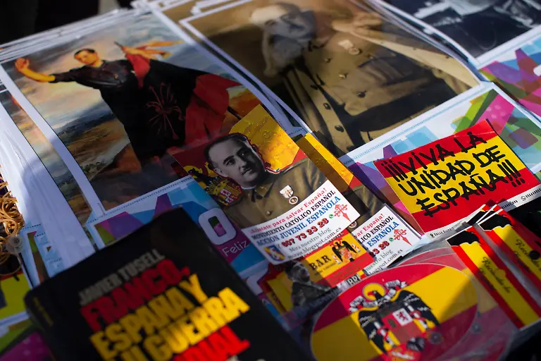 Souvenirs-of-Francisco-Franco-and-Primo-de-Rivera-for-sale-during-a-rally-commemorating-the-anniversary-of-the-death-of-dictator-Francisco-Franco-on-November-20-1975-and-of-Jose-Antonio-Primo-de-Rivera-on-November-20-1936-founder-of-the-right-wing-group-Falange-Espanola-in-the-Plaza-de-Oriente-in-Madrid