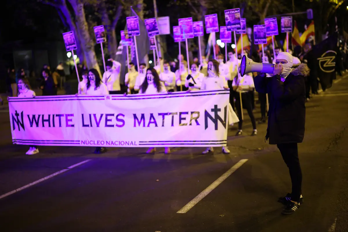 Far-right-demonstrators-hold-a-White-lives-matter-banner-as-they-march-towards-Spain-s-Parliament-under-the-slogan-Join-us-to-save-Spain-in-Madrid-Spain-November-8-2025-In-Spain-the-public-display-distribution-or-use-of-dictator-Franco-symbols-and-propaganda-is-not-a-crime-unless-it-humiliates-the-victims-or-there-s-a-glorification-of-the-dictatorship