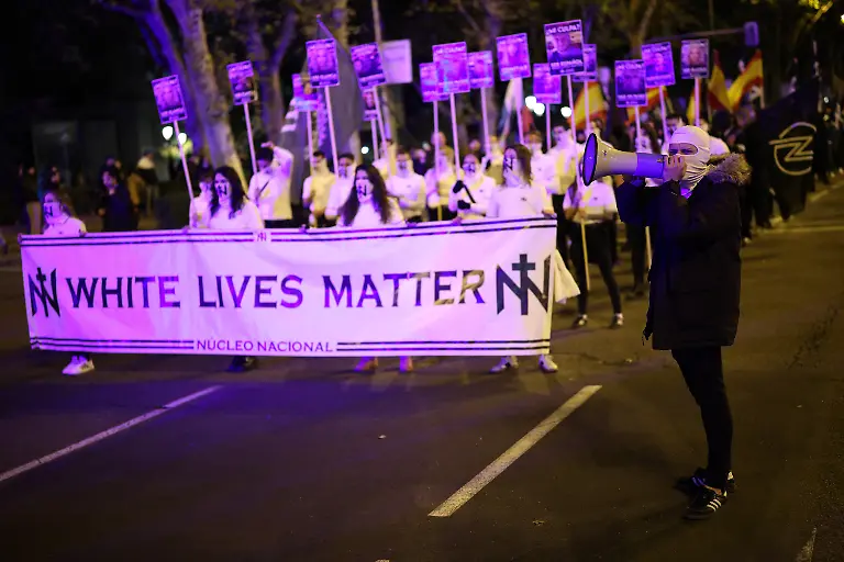 Far-right-demonstrators-hold-a-White-lives-matter-banner-as-they-march-towards-Spain-s-Parliament-under-the-slogan-Join-us-to-save-Spain-in-Madrid-Spain-November-8-2025-In-Spain-the-public-display-distribution-or-use-of-dictator-Franco-symbols-and-propaganda-is-not-a-crime-unless-it-humiliates-the-victims-or-there-s-a-glorification-of-the-dictatorship