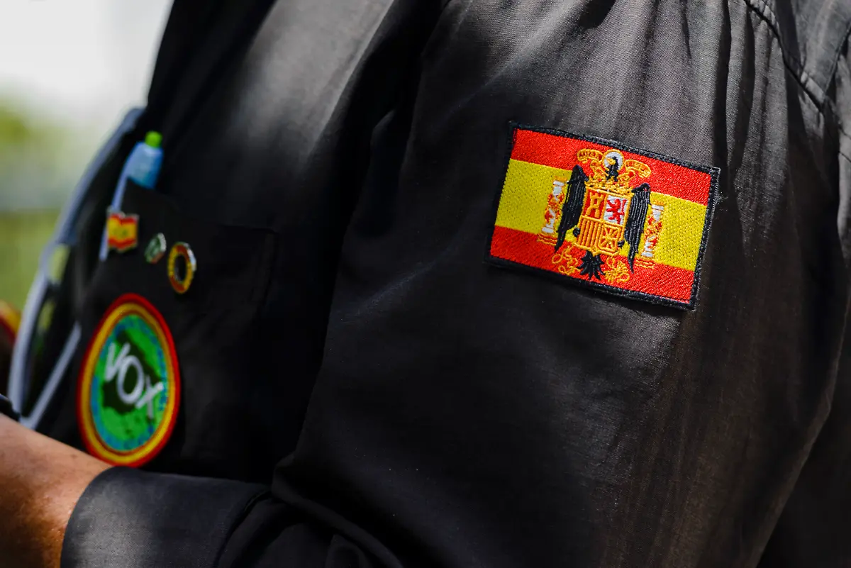 June-11-2022-Seville-Seville-Spain-A-VOX-supporter-wearing-a-shirt-with-Spanish-Francoist-flag-widely-used-by-far-right-and-neo-nazi-groups-An-act-of-the-Spanish-far-right-political-party-VOX-took-place-today-in-Mairena-del-Aljarafe-Seville-Spain-The-General-Secretary-of-VOX-and-the-Candidate-for-Sevilla-gave-speecheses-against-the-other-political-parties-in-these-elections