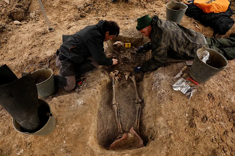 David-Ramirez-and-Serxio-Castro-members-of-the-Association-for-the-Recovery-of-Historical-Memory-ARMH-take-part-in-the-exhumation-of-a-mass-grave-of-one-of-the-two-victims-who-were-shot-in-1936-by-forces-of-Spanish-dictator-Francisco-Franco-near-Vegas-de-Matute-Spain-November-13-2025