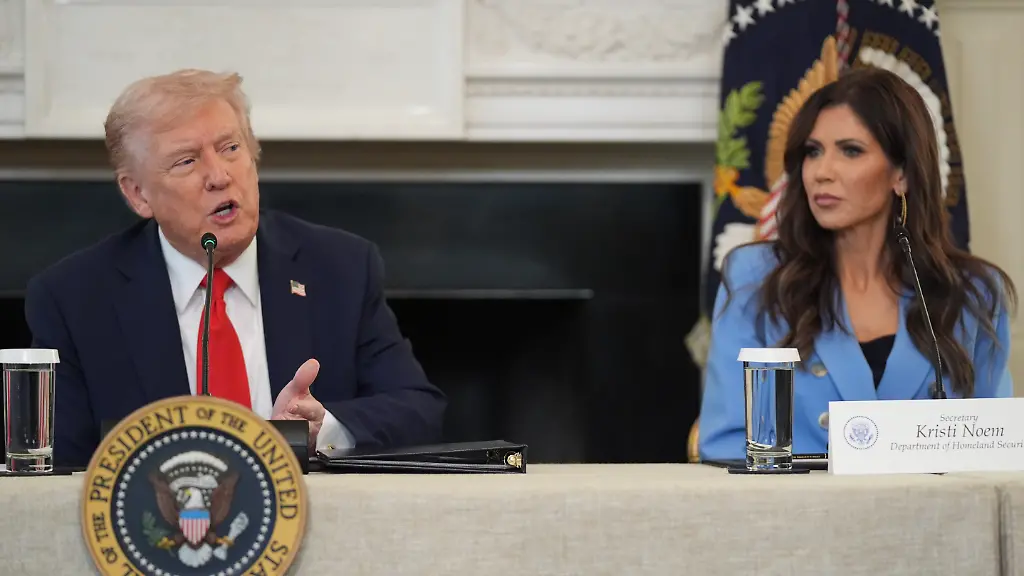 President-Donald-Trump-speaks-during-a-roundtable-meeting-on-antifa-in-the-State-Dining-Room-at-the-White-House-Wednesday-Oct-8-2025-in-Washington-as-Homeland-Security-Secretary-Kristi-Noem-listens