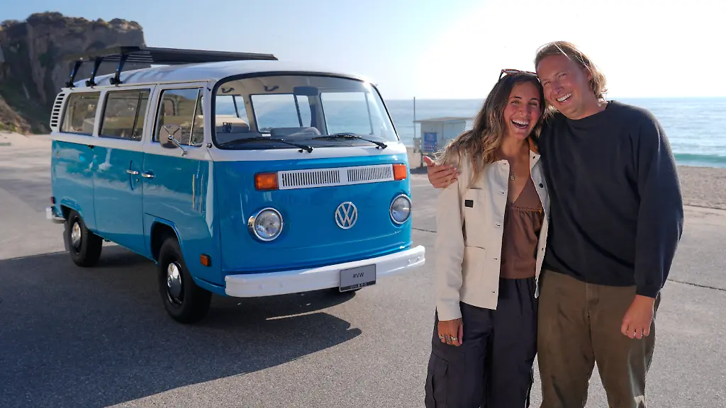 Megan-Krystle-Weinraub-left-and-Preston-Martin-who-is-the-former-owner-pose-in-front-of-her-Volkswagen-bus-after-seeing-it-for-the-first-time-Monday-Oct-27-2025-in-Malibu-Calif-after-it-was-restored-by-VW-AP-Photo-Mark-J