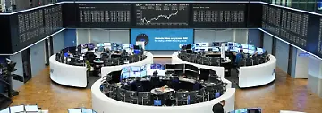 A-graph-of-the-German-share-price-index-DAX-is-displayed-at-the-stock-exchange-in-Frankfurt-Germany-November-19-2025