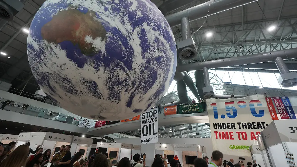 Activists-hang-banners-one-reading-stop-Amazon-oil-while-participating-in-a-demonstration-at-the-COP30-U-N-Climate-Summit-Friday-Nov-21-2025-in-Belem-Brazil