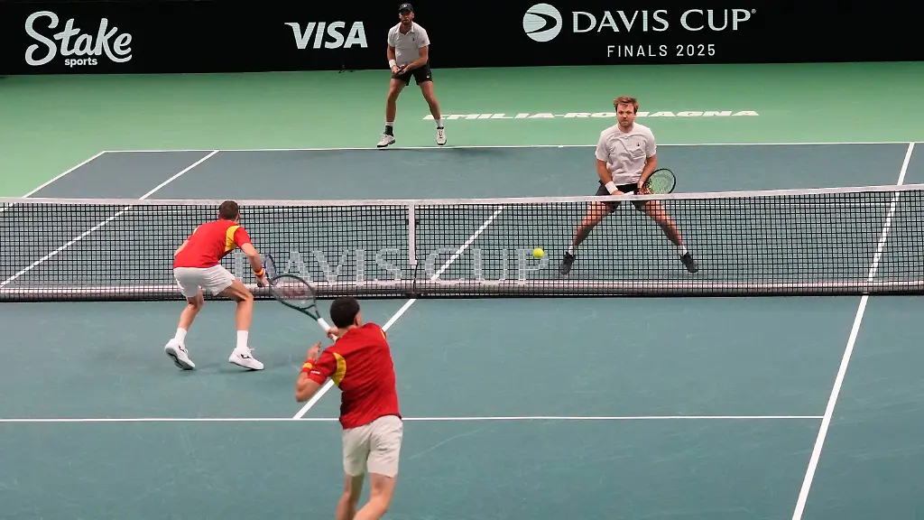 Spain-s-Marcel-Granollers-and-Pedro-Martinez-bottom-return-the-ball-to-Germany-s-Kevin-Krawietz-and-Tim-Puetz-during-a-Davis-Cup-double-semifinal-tennis-match-between-Spain-and-Germany-in-Bologna-Italy-Saturday-Nov-22-2025