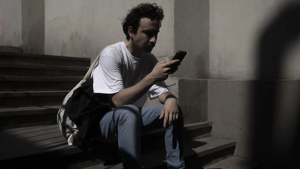 ISTANBUL-TURKIYE-JUNE-08-A-man-uses-a-mobile-phone-in-Istanbul-Turkiye-on-June-08-2024