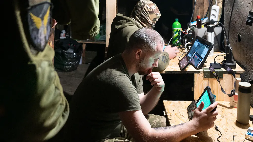 UKRAINE-2025-02-11-Inside-an-underground-bunker-Ukrainian-drone-operators-fly-a-drone-to-target-Russian-positions-on-the-frontline-The-war-between-Ukraine-and-Russia-has-shown-how-inexpensive-and-expendable-drones-like-kamikaze-or-bomb-dropping-models-are-reshaping-warfare-These-drones-allow-for-precise-low-cost-strikes-and-have-proven-highly-effective-in-disrupting-enemy-operations-As-a-result-they-are-changing-military-strategies-signaling-a-future-where-drones-play-a-central-role-in-combat-reducing-reliance-on-traditional-expensive-weaponry