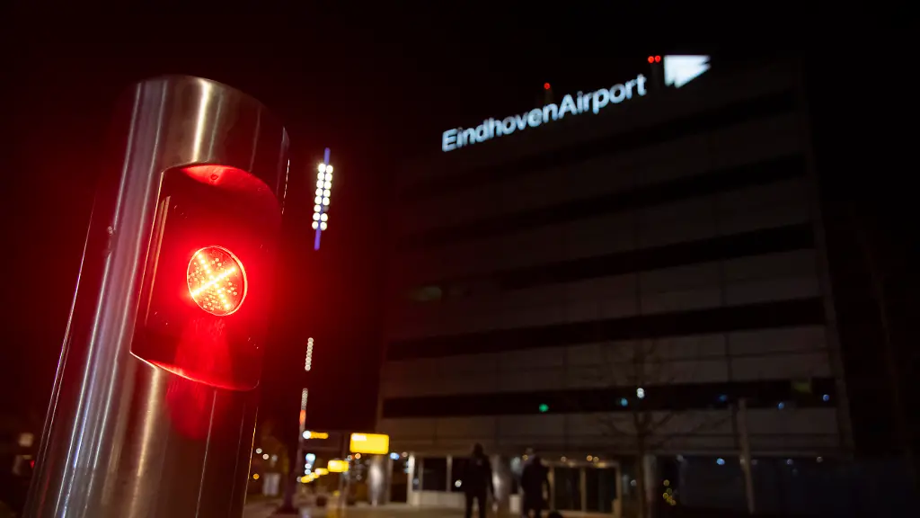 Eindhoven-Airport-illuminating-logo-inscription-Eindhoven-Airport-was-significantly-disrupted-travel-evening-after-air-traffic-was-suspended-for-several-hours-due-to-multiple-drone-sightings-in-the-vicinity-The-suspension-impacted-hundreds-of-passengers-in-the-evening-and-lasted-for-approximately-two-hours-with-flights-only-resuming-around-11-00-PM-The-incident-stranded-hundreds-of-travelers-in-the-departure-hall-with-many-flights-being-diverted-to-alternative-airports-in-the-country-as-well-as-in-Belgium-and-Germany-Dutch-Minister-of-Defence-confirmed-that-defence-counter-drone-measures-were-ready-to-intervene-and-that-action-was-taken-against-the-unmanned-aerial-vehicles-The-closure-at-Eindhoven-came-the-same-day-when-the-Dutch-military-used-weapons-against-drones-sighted-above-the-Volkel-Air-Base-located-a-few-kilometers-northeast-which-hosts-the-Dutch-F-35-fighter-jets-The-origin-of-the-drones-remains-unknown-and-the-incident-is-part-of-a-wider-pattern-of-disruptive-airspace-incursions-across-Europe-with-many-recently-in-Brussels-that-have-raised-security-alerts-and-been-described-by-European-leaders-as-a-form-of-hybrid-warfare-Eindhoven-Airport-is-both-a-public-and-military-one-an-Air-Base-with-NATO-aircraft-known-as-Welschap-After-the-incident-only-Transavia-low-cost-airline-returned-the-planes-back