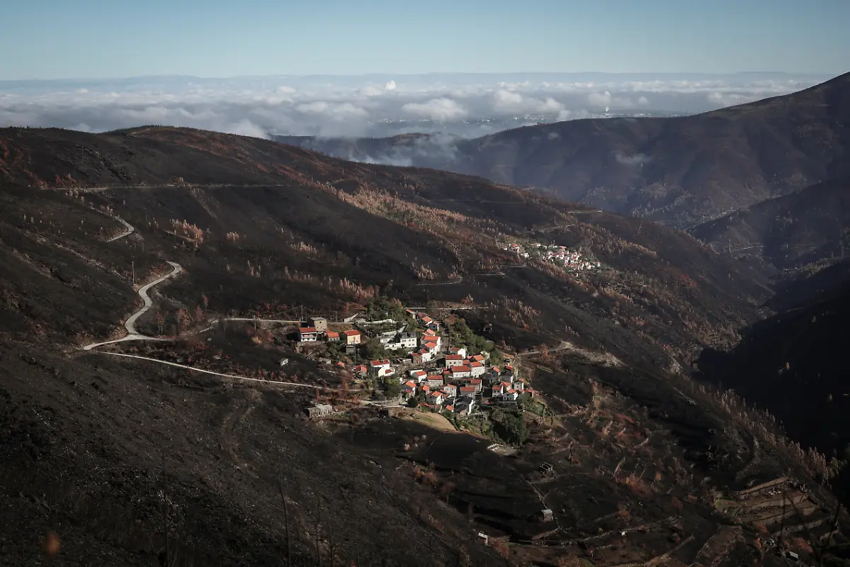 Villages-are-seen-in-the-aftermath-of-a-wildfire-near-Arganil-Portugal-September-11-2025-Although-the-record-breaking-wildfires-that-ripped-across-Spain-and-Portugal-in-August-have-subsided-residents-in-rural-communities-in-Spain-s-northwestern-Galicia-region-are-still-battling-the-aftermath-Spain-s-COAG-national-farmers-association-estimated-that-the-fires-had-caused-at-least-600-million-euros-699-72-million-in-damages-devastating-crops-and-buildings-and-leaving-livestock-dead-in-the-fields-REUTERS-Pedro-Nunes-SEARCH-IBERIA-WILDFIRES-AFTERMATH-FOR-THIS-STORY-SEARCH-WIDER-IMAGE-FOR-ALL-STORIES