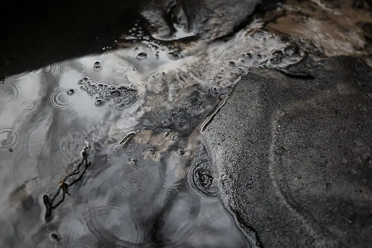 Ash-and-mud-dragged-by-seasonal-rains-is-pictured-inside-a-sandtrap-or-arenero-which-decants-rainwater-to-prevent-debris-from-reaching-the-water-line-after-a-wildfire-in-August-in-the-mountain-range-of-Serra-do-Larouco-Galicia-Spain-November-7-2025-As-the-seasonal-October-rains-picked-up-the-entire-vegetative-layer-which-had-turned-to-ash-began-to-clog-the-sandtraps-known-locally-as-areneros-that-decant-rainwater-to-prevent-debris-from-reaching-the-water-line-feeding-the-reservoir-We-have-been-here-for-almost-a-month-working-to-remove-the-ash-mixed-with-mud-said-Raul-Lopez-a-worker-for-the-municipality-We-have-never-seen-a-disaster-like-this-before-in-our-lives-Neither-my-grandfather-nor-my-father-nor-anyone-else-can-remember-a-disaster-like-this-REUTERS-Nacho-Doce-SEARCH-IBERIA-WILDFIRES-AFTERMATH-FOR-THIS-STORY-SEARCH-WIDER-IMAGE-FOR-ALL-STORIES