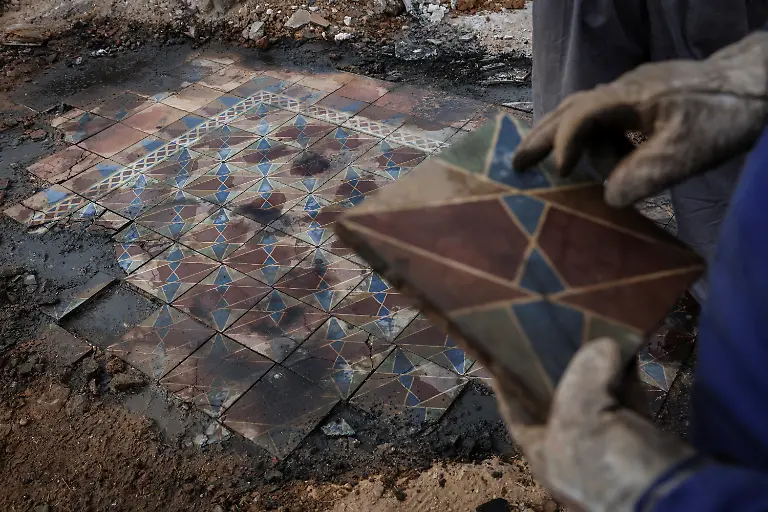 Gonzalo-Diez-60-touches-a-ceramic-tile-from-his-mother-s-kitchen-floor-the-only-remnant-of-his-family-home-where-he-and-his-brothers-were-born-after-it-was-destroyed-by-a-wildfire-in-San-Pedro-de-Cansoles-Castilla-y-Leon-Spain-September-2-2025-The-fires-forced-more-than-42-000-people-across-Spain-to-evacuate-according-to-the-Ministry-of-Interior-with-some-returning-to-find-their-homes-had-been-reduced-to-ashes-If-I-come-by-myself-I-hardly-even-feel-like-being-here-I-must-come-with-someone-It-brings-back-memories-that-otherwise-I-probably-wouldn-t-even-remember-Diez-said-I-think-I-still-haven-t-fully-processed-the-whole-situation-REUTERS-Violeta-Santos-Moura-SEARCH-IBERIA-WILDFIRES-AFTERMATH-FOR-THIS-STORY-SEARCH-WIDER-IMAGE-FOR-ALL-STORIES