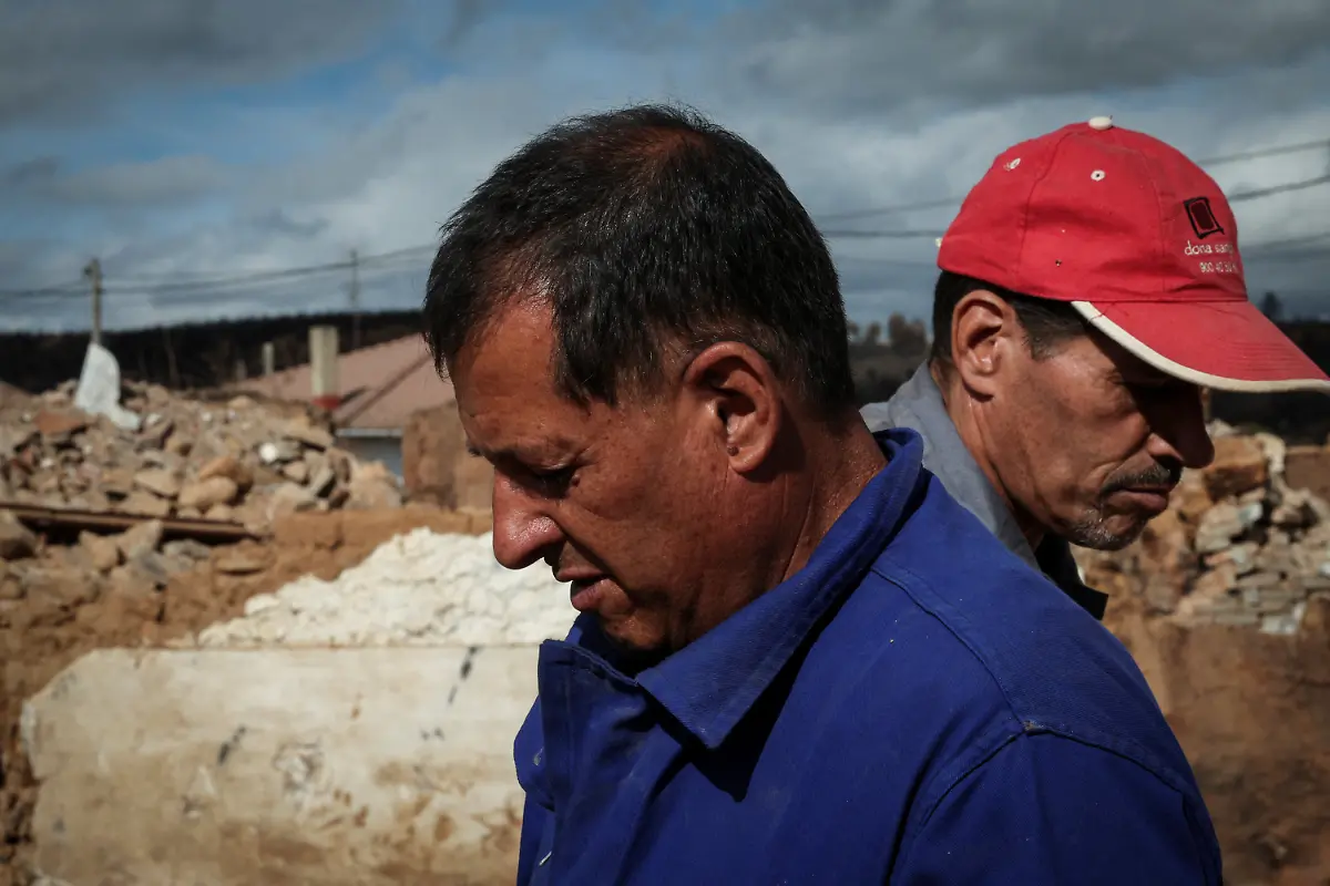 Brothers-Gonzalo-Diez-left-60-and-Isaac-examine-ceramic-floor-tiles-amid-the-ruins-of-their-family-home-the-only-feature-spared-by-the-wildfire-that-consumed-the-house-where-they-were-born-in-San-Pedro-de-Cansoles-Castilla-y-Leon-Spain-September-2-2025-The-fires-forced-more-than-42-000-people-across-Spain-to-evacuate-according-to-the-Ministry-of-Interior-with-some-returning-to-find-their-homes-had-been-reduced-to-ashes-If-I-come-by-myself-I-hardly-even-feel-like-being-here-I-must-come-with-someone-It-brings-back-memories-that-otherwise-I-probably-wouldn-t-even-remember-Diez-said-I-think-I-still-haven-t-fully-processed-the-whole-situation-REUTERS-Violeta-Santos-Moura-SEARCH-IBERIA-WILDFIRES-AFTERMATH-FOR-THIS-STORY-SEARCH-WIDER-IMAGE-FOR-ALL-STORIES