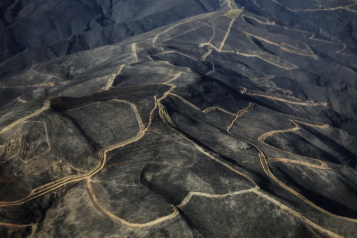 Thousands-of-charred-hectares-are-seen-in-the-mountains-of-the-municipalities-of-A-Rua-and-Villamartin-de-Valdeorras-Galicia-Spain-September-16-2025-Although-the-record-breaking-wildfires-that-ripped-across-Spain-and-Portugal-in-August-have-subsided-residents-in-rural-communities-in-Spain-s-northwestern-Galicia-region-are-still-battling-the-aftermath-What-happened-here-is-crazy-said-Cristina-Santin-a-biologist-from-northwestern-Spain-who-studies-fire-impacts-Suddenly-you-get-up-one-day-and-your-home-region-is-burning-on-a-scale-that-is-completely-unprecedented-REUTERS-Nacho-Doce-SEARCH-IBERIA-WILDFIRES-AFTERMATH-FOR-THIS-STORY-SEARCH-WIDER-IMAGE-FOR-ALL-STORIES