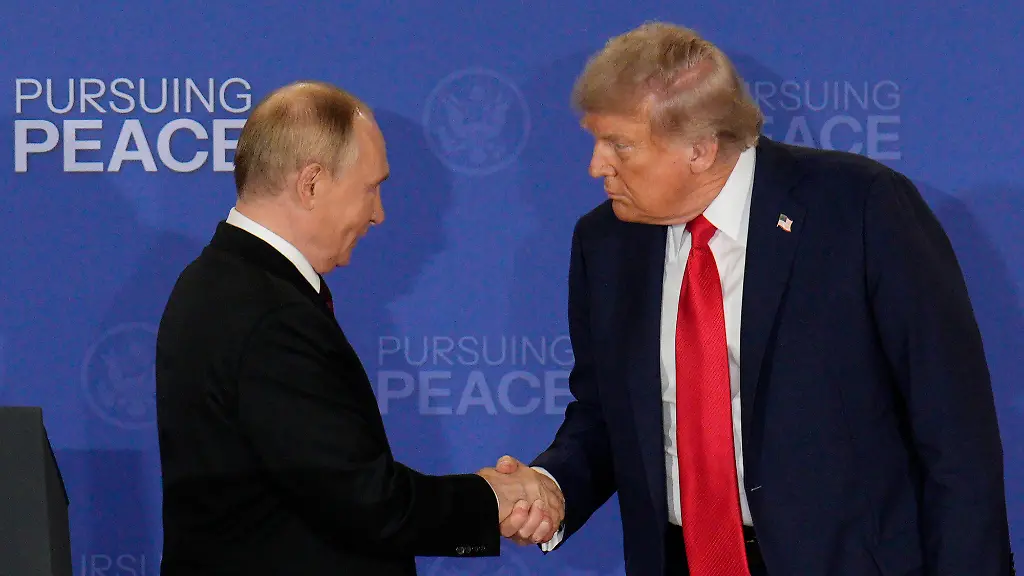 Russian-President-Vladimir-Putin-shakes-hands-with-President-Donald-Trump-after-a-joint-press-conference-following-a-meeting-at-Joint-Base-Elmendorf-Richardson-in-Anchorage-Alaska-on-Friday-August-15-2025-Trump-and-Putin-met-to-discuss-the-three-year-old-conflict-between-Russia-and-Ukraine