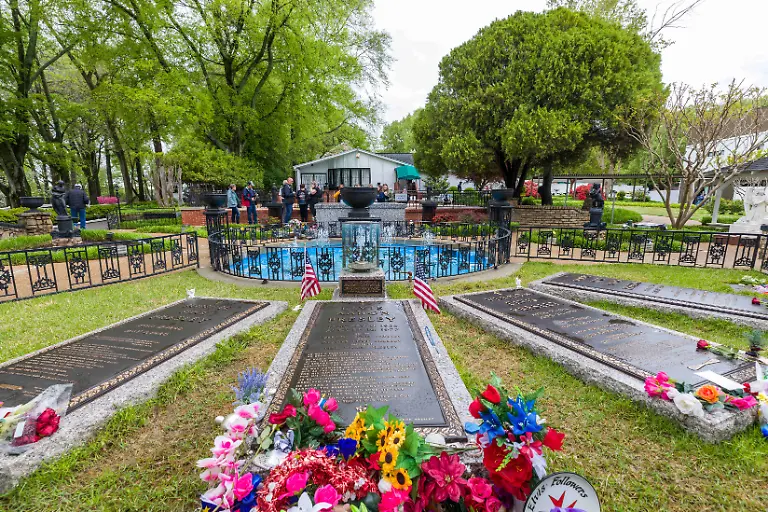 Elvis-Presley-s-tombstone-in-the-meditation-garden-of-the-Elvis-Presley-house-Graceland-in-Memphis-Tennessee-USA-on-April-10-2024-Photo-by-Pascal-Avenet-ABACAPRESS