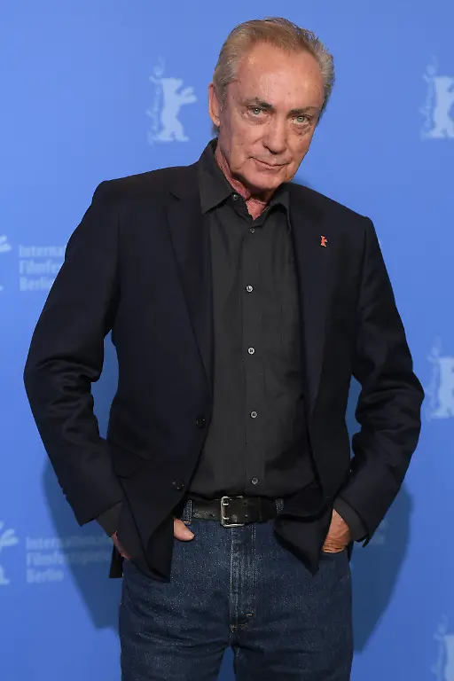 BERLIN-GERMANY-FEBRUARY-13-Actor-Udo-Kier-poses-at-the-La-Fiera-Y-La-Fiesta-Holy-Beasts-photocall-during-the-69th-Berlinale-International-Film-Festival-Berlin-at-Grand-Hyatt-Hotel-on-February-13-2019-in-Berlin-Germany