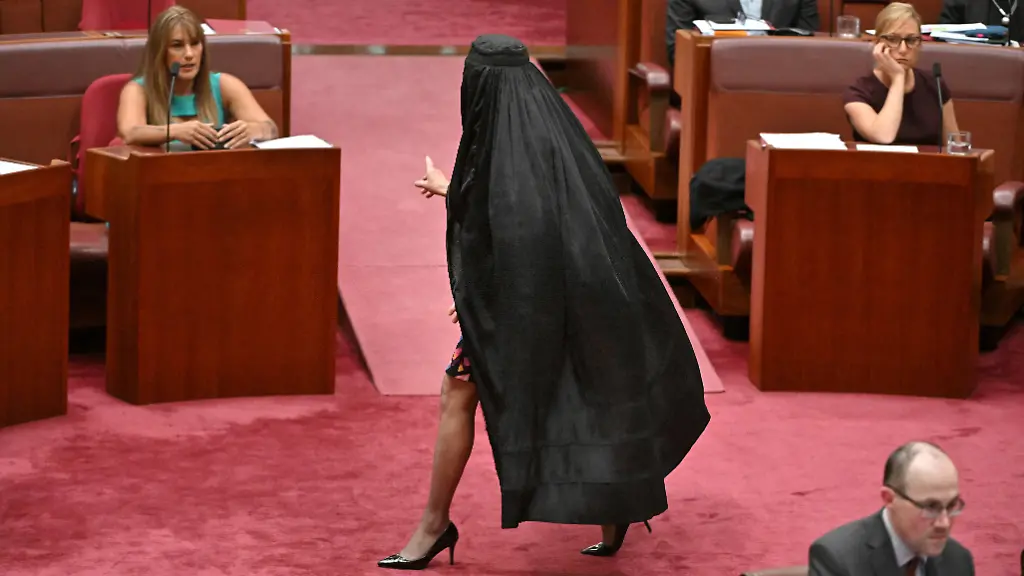 One-Nation-leader-Pauline-Hanson-wears-a-burqa-in-the-Senate-chamber-at-Parliament-House-in-Canberra-Australia-November-24-2025-AAP-Mick-Tsikas-via-REUTERS-ATTENTION-EDITORS-THIS-IMAGE-WAS-PROVIDED-BY-A-THIRD-PARTY-NO-RESALES-NO-ARCHIVE-AUSTRALIA-OUT-NEW-ZEALAND-OUT-NO-COMMERCIAL-OR-EDITORIAL-SALES-IN-NEW-ZEALAND-NO-COMMERCIAL-OR-EDITORIAL-SALES-IN-AUSTRALIA