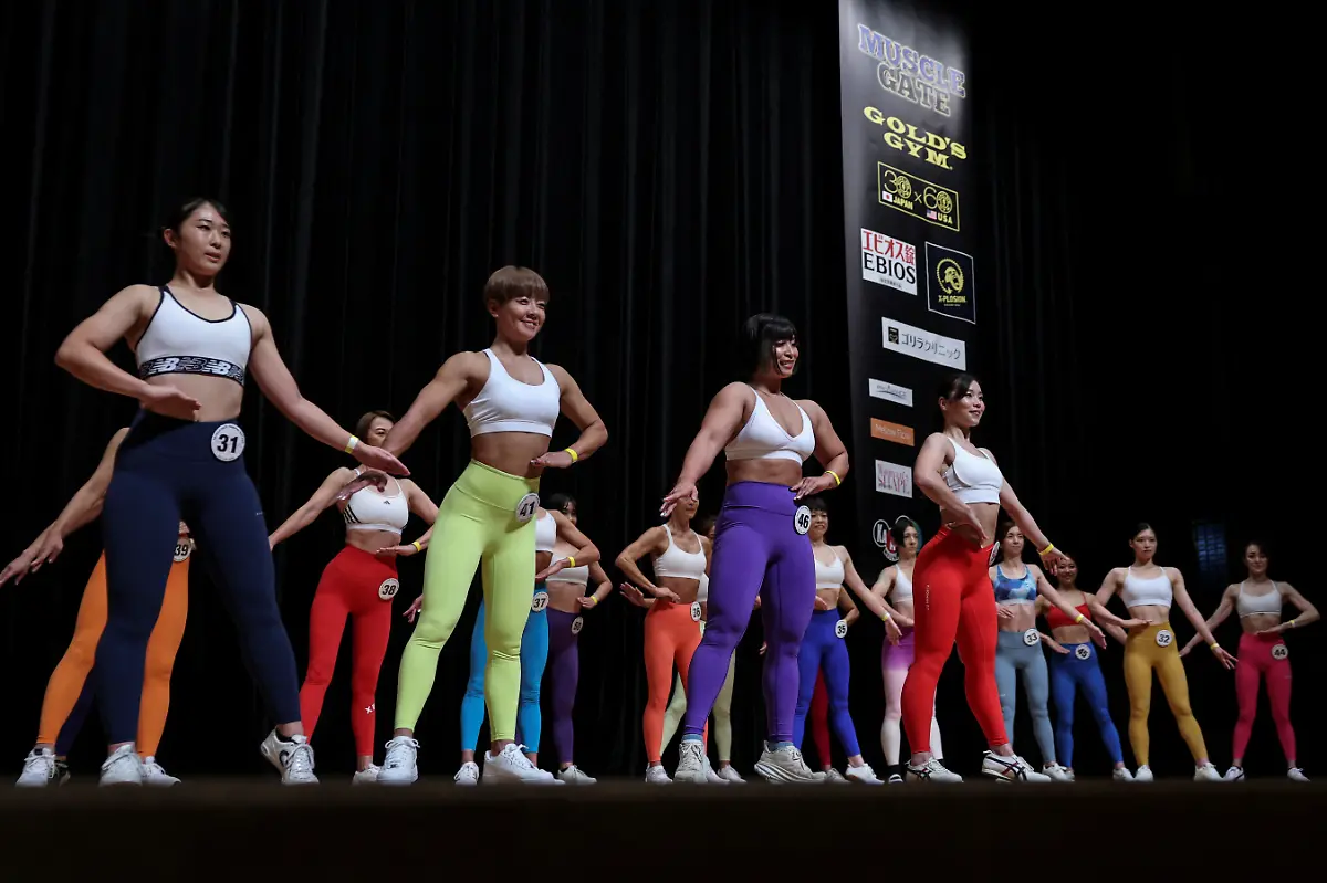Hitomi-Harigae-38-manager-of-Muscle-Girls-a-fitness-themed-bar-in-Tokyo-participates-in-the-regional-competition-of-Muscle-Gate-a-bodybuilding-tournament-in-Saitama-Japan-October-11-2025-Female-bodybuilding-has-gained-popularity-in-Japan-in-recent-years-with-competitions-held-in-many-cities-But-outside-that-circle-the-old-conventions-rule-Harigae-said-REUTERS-Kim-Kyung-Hoon-SEARCH-KYUNG-HOON-MUSCLE-GIRLS-FOR-THIS-STORY-SEARCH-WIDER-IMAGE-FOR-ALL-STORIES