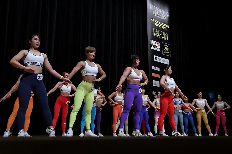 Hitomi-Harigae-38-manager-of-Muscle-Girls-a-fitness-themed-bar-in-Tokyo-participates-in-the-regional-competition-of-Muscle-Gate-a-bodybuilding-tournament-in-Saitama-Japan-October-11-2025-Female-bodybuilding-has-gained-popularity-in-Japan-in-recent-years-with-competitions-held-in-many-cities-But-outside-that-circle-the-old-conventions-rule-Harigae-said-REUTERS-Kim-Kyung-Hoon-SEARCH-KYUNG-HOON-MUSCLE-GIRLS-FOR-THIS-STORY-SEARCH-WIDER-IMAGE-FOR-ALL-STORIES