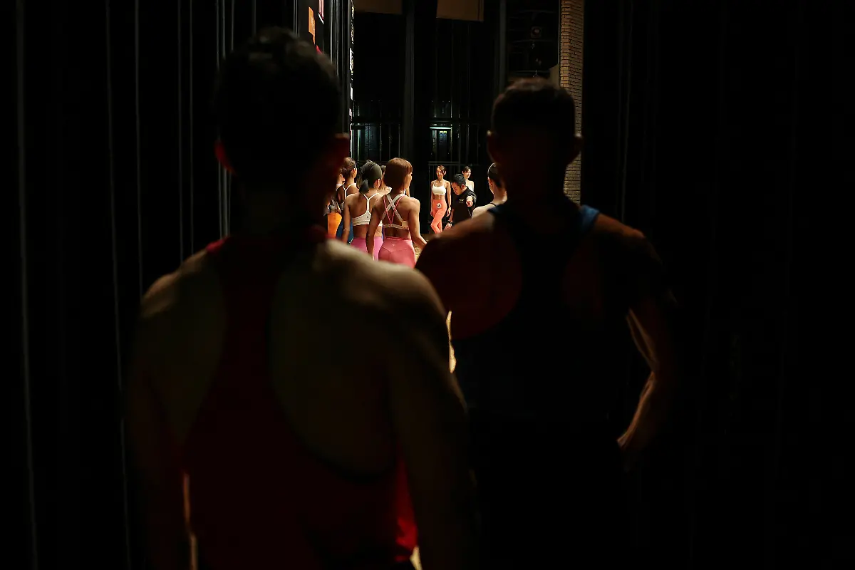 Male-competitors-stand-backstage-and-look-at-female-competitors-on-stage-during-the-regional-competition-of-Muscle-Gate-a-bodybuilding-tournament-in-Saitama-Japan-October-11-2025-REUTERS-Kim-Kyung-Hoon-SEARCH-KYUNG-HOON-MUSCLE-GIRLS-FOR-THIS-STORY-SEARCH-WIDER-IMAGE-FOR-ALL-STORIES