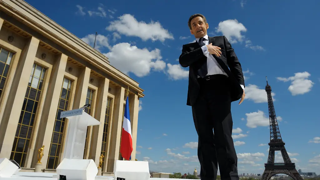 France-s-President-and-UMP-party-candidate-for-his-re-election-in-the-2012-French-presidential-elections-Nicolas-Sarkozy-waves-to-supporters-as-he-arrives-on-stage-to-deliver-his-speech-at-Trocadero-square-during-a-campaign-rally-in-Paris-France-on-May-1-2012-French-President-Sarkozy-will-compete-with-trade-unions-to-draw-the-biggest-May-Day-crowd-on-Tuesday-seeking-to-steal-the-limelight-from-their-annual-street-march-in-the-final-countdown-to-Sunday-s-election-runoff-Photo-by-Philippe-Wojazer-Pool-ABACAPRESS
