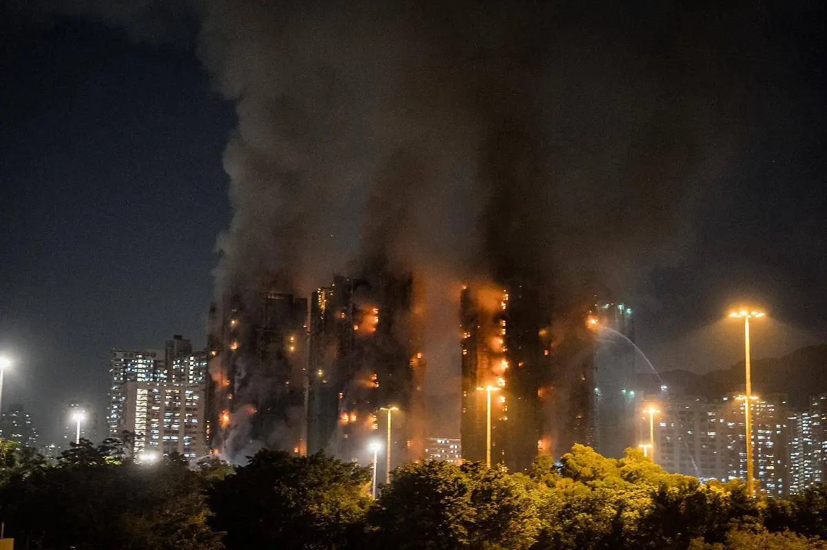 Fire-at-Hong-Kong-housing-estate-kills-at-least-4-injures-3-HONG-KONG-NOV-26-2025-Smoke-rises-after-major-fire-broke-out-at-a-housing-estate-in-Hong-Kong-on-November-26-2025-At-least-four-people-including-a-firefighter-died-while-three-others-were-injured-Stringer-Anadolu-Hong-Kong-China-Editorial-use-only-Please-get-in-touch-for-any-other-usage