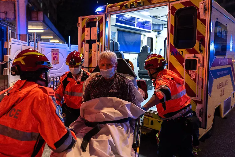 An-injured-person-is-lifted-into-an-ambulance-after-a-fire-broke-out-at-Wang-Fuk-Court-a-residential-estate-in-the-Tai-Po-district-of-Hong-Kong-s-New-Territories-Wednesday-Nov-26-2025