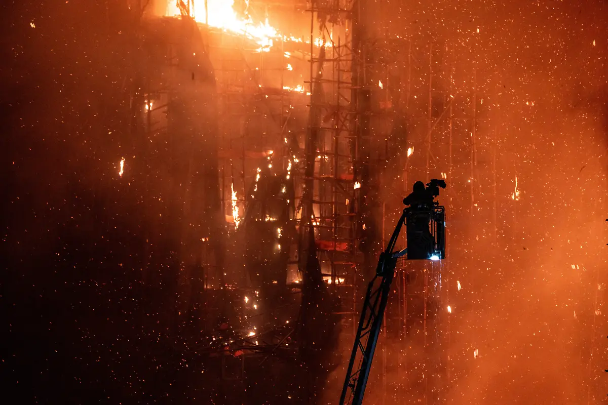 Hong-Kong-Building-Fire-A-firefighter-on-a-fire-tuck-ladder-as-Smoke-and-flames-rise-as-a-major-fire-engulfs-several-residential-buildings-at-Wang-Fuk-Court-on-November-26-2025-in-Hong-Kong-Serval-residential-building-in-Wang-Fuk-Court-located-in-Tai-Po-District-caught-fire-today-the-Hong-Kong-Fire-Department-has-issued-the-No-5-fire-alarm-the-fire-at-local-time-1800-has-claimed-the-life-of-one-firefighter-and-three-other-people