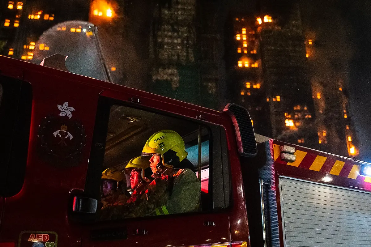 Firefighters-rest-at-the-fire-truck-after-a-fire-broke-out-at-Wang-Fuk-Court-a-residential-estate-in-the-Tai-Po-district-of-Hong-Kong-s-New-Territories-Wednesday-Nov-26-2025